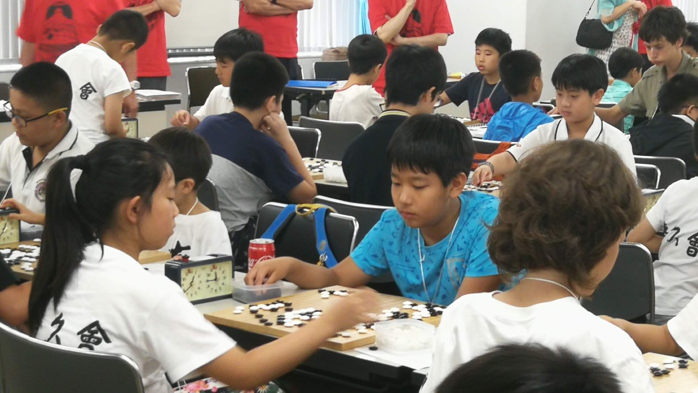 A crowded youth Go tournament hall in summer 2018