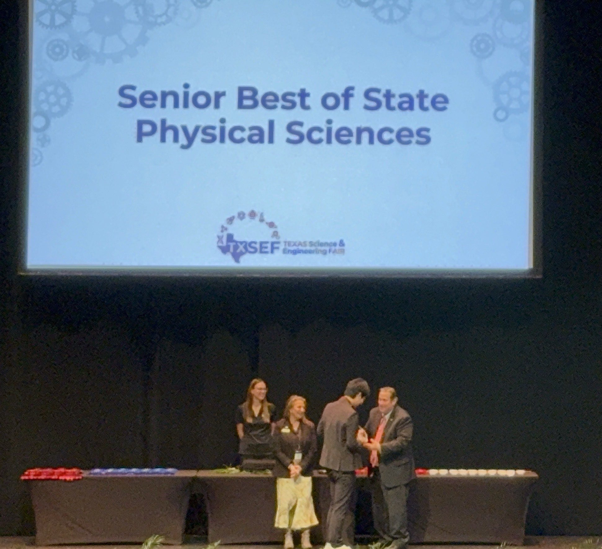 Alan receiving the Senior Best of State award in Physical Sciences at TXSEF